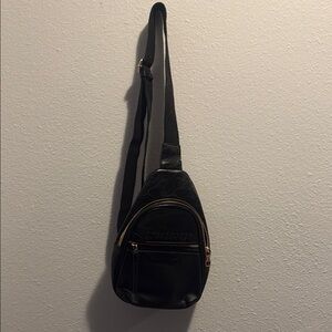 Sleek Black Crossbody Bag with Glossy Finish